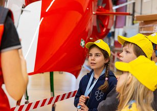 A girl listens intently.